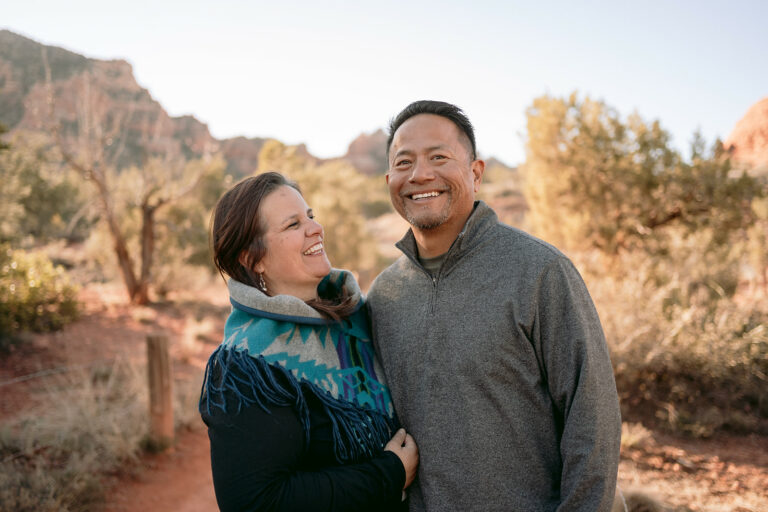 Husband and wife laugh on the Bell Rock trail in Sedona.