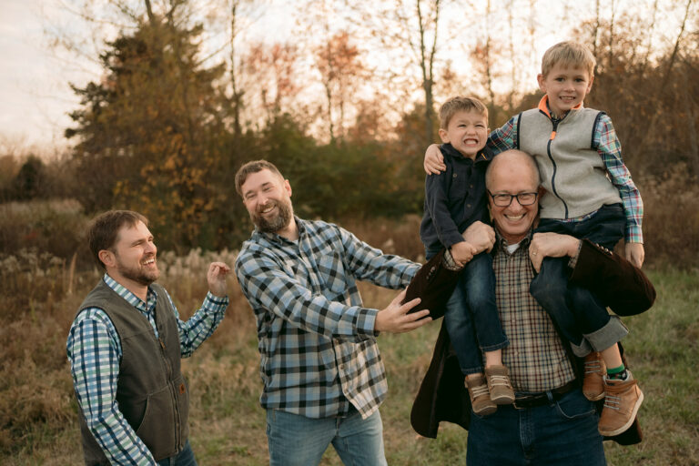 All of the boys in the family take a silly photo together during the extended family photo session after Thanksgiving
